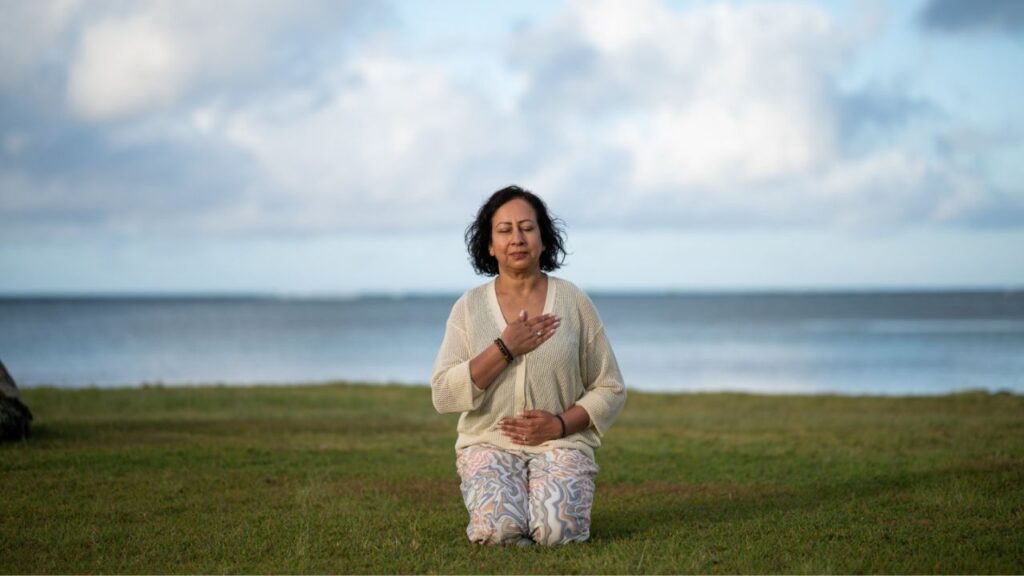 Meena meditates on the beach
